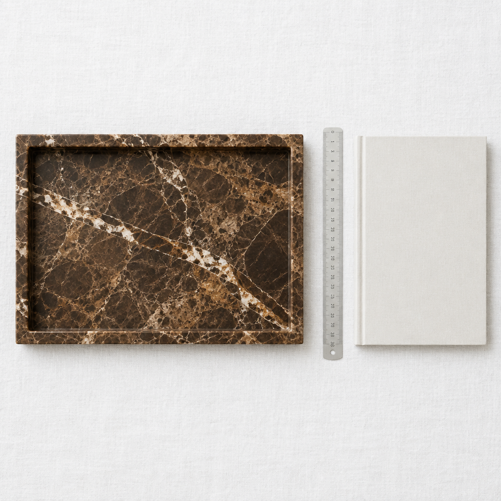 Brown marble tray flat-lay overhead shot with scale reference on white linen